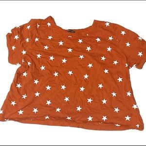 brownish colored shirt with cute white stars.